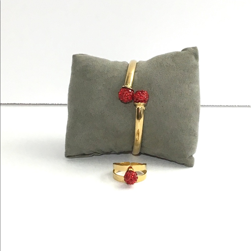 Gold Stainless Steel Bracelet with a Red Round .